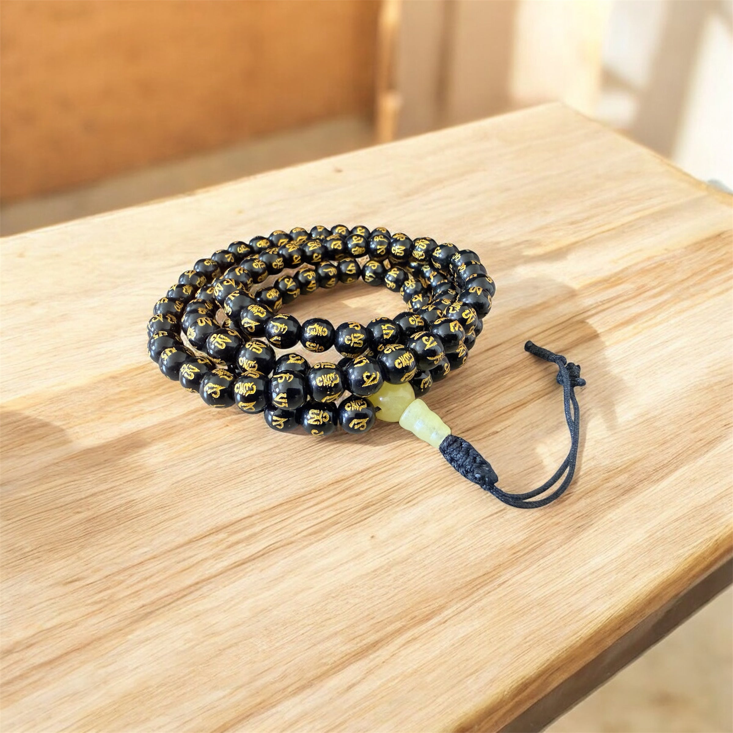 Om Mani Padme Hung carved Black Agate Mala