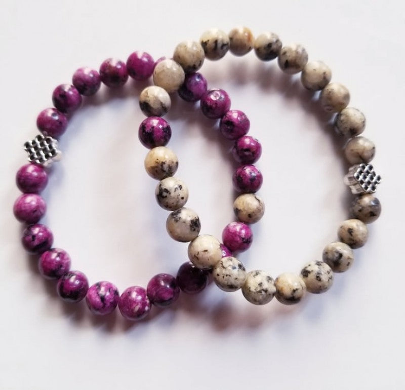 PURPLE AND WHITE STONE BRACELETS WITH ETERNAL KNOT CHARMS